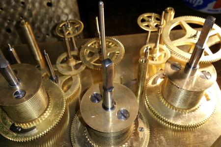 Intricate brass clock movement gears